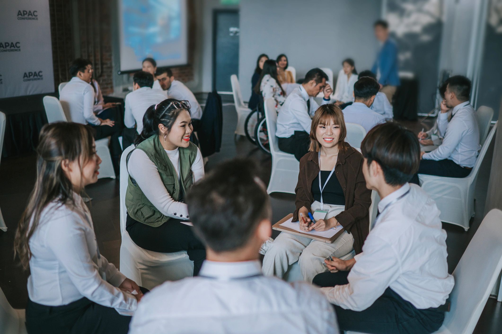 Workshop participants collaborating in a business session